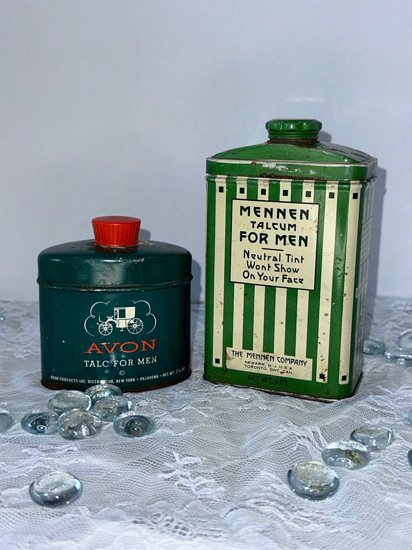 Antique Mennen talcum powder and Avon talcum powder